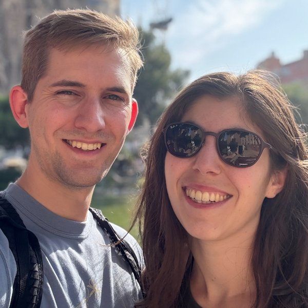 Colin and Yasmine smiling together outdoors