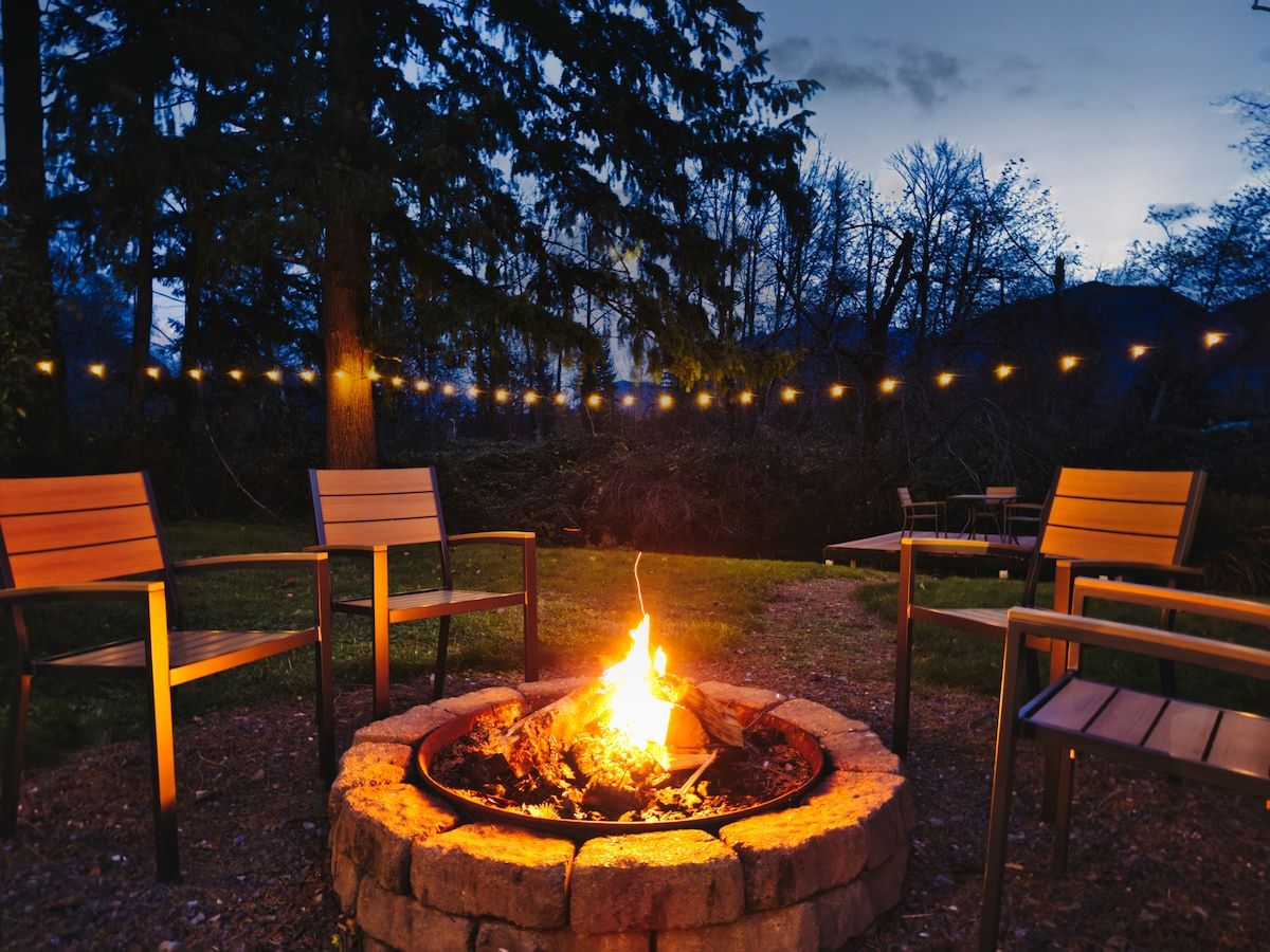 Fire pit with chairs at dusk