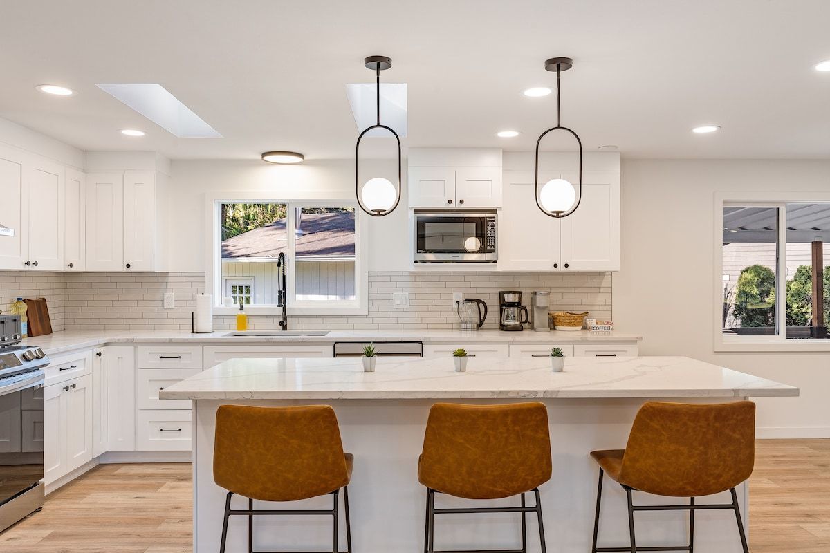 Kitchen island with barstools and new appliances